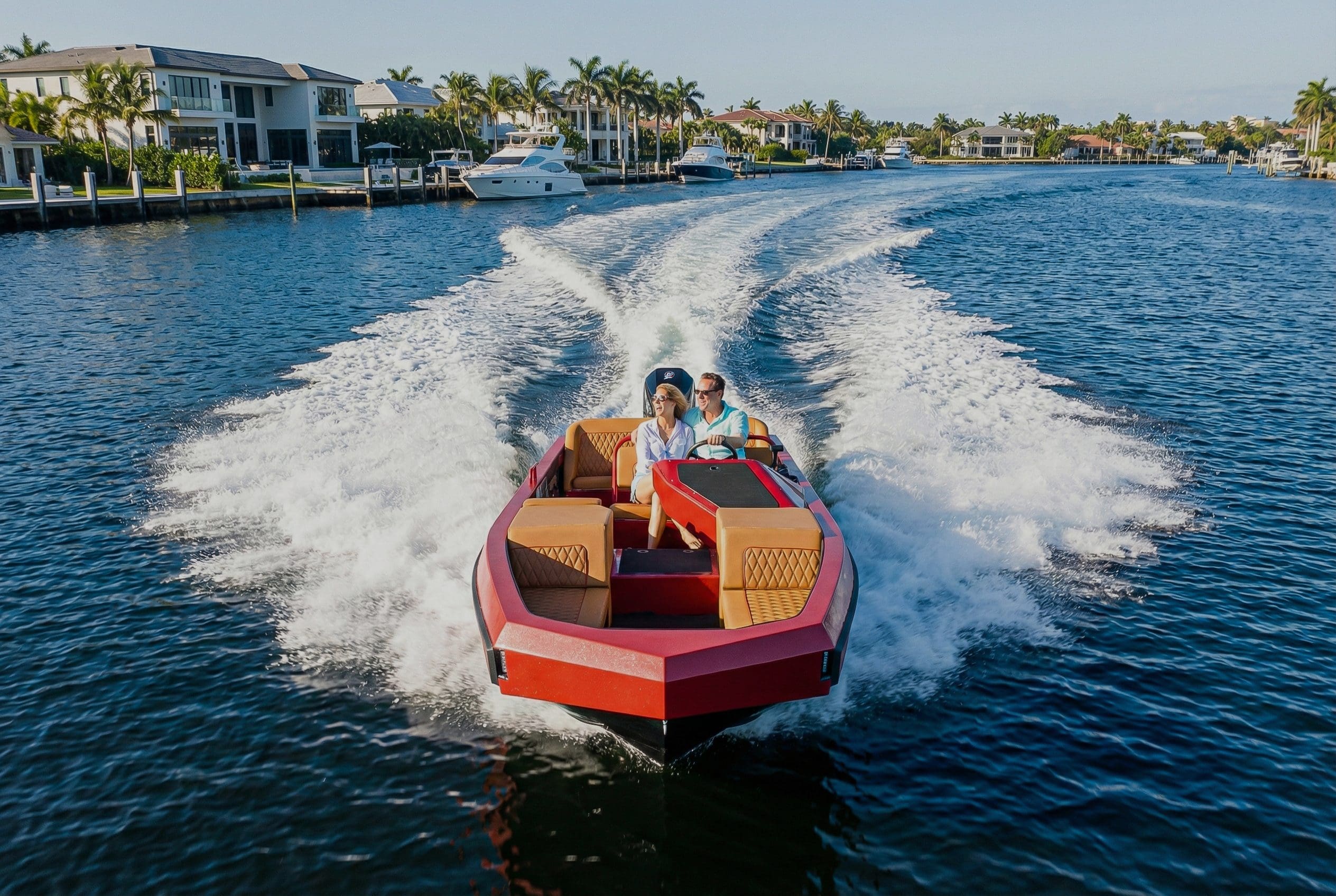 A couple riding a red Water boat